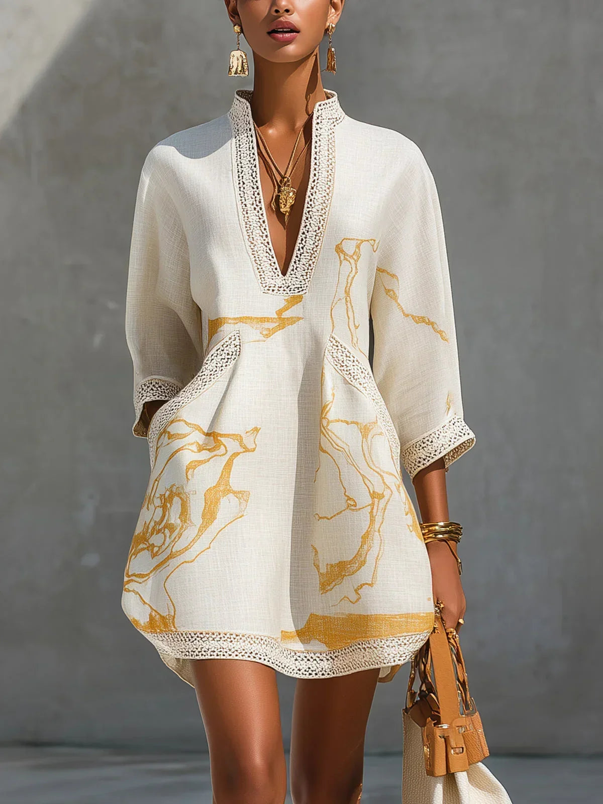 Donatella | Black minidress with golden marble print and crochet lace